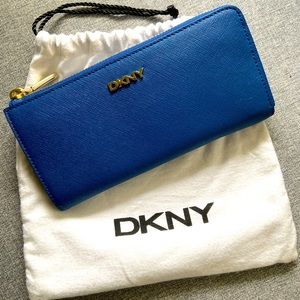 DKNY blue wallet with gold trim.